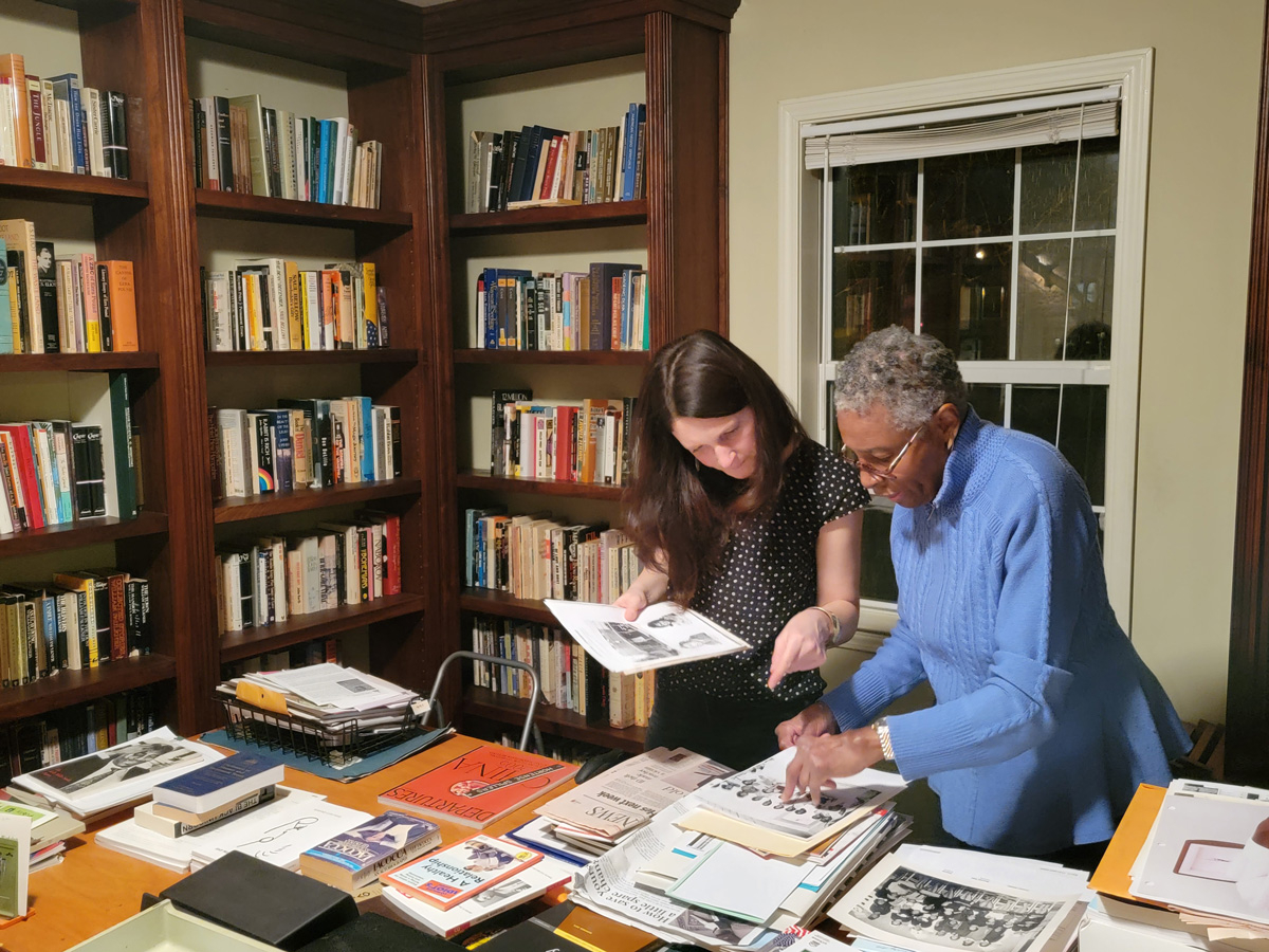 Hortense J. Spillers looking at materials in a library