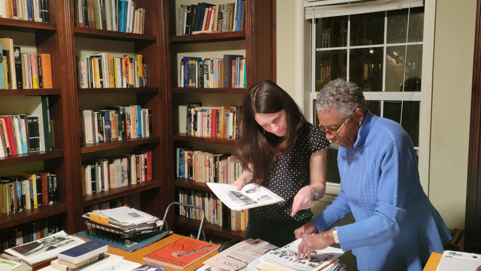 Hortense J. Spillers looking at materials in a library